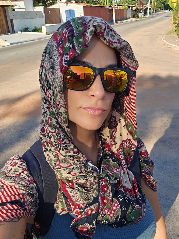 Person in orange sunglasses photographed in Búzios, Brazil