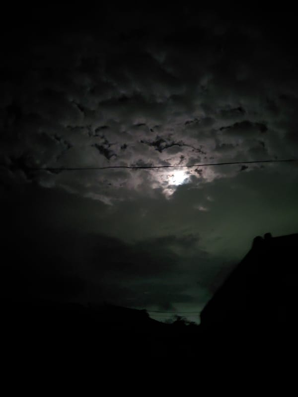 Cloudy night moon observed over Santa Ana, Venezuela