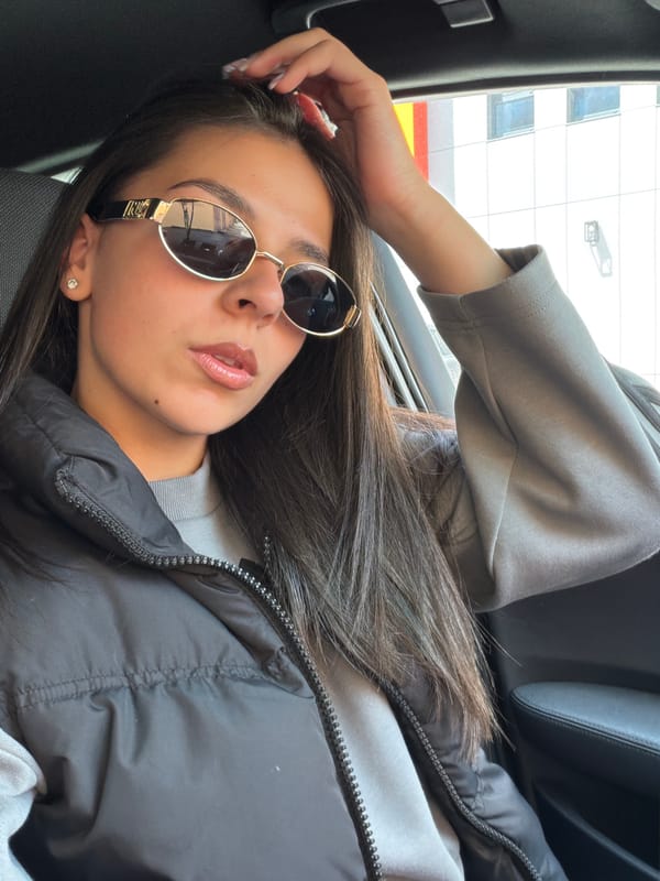 Woman rests in parked BMW in Gabrovo, Bulgaria