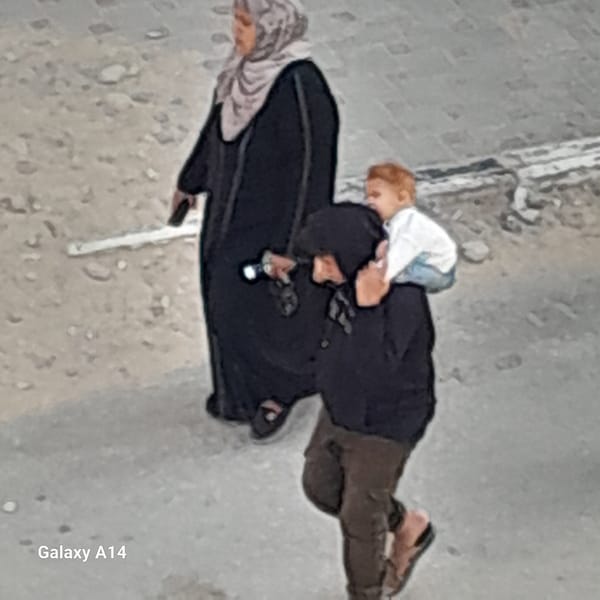 Family group observed walking on urban concrete surface