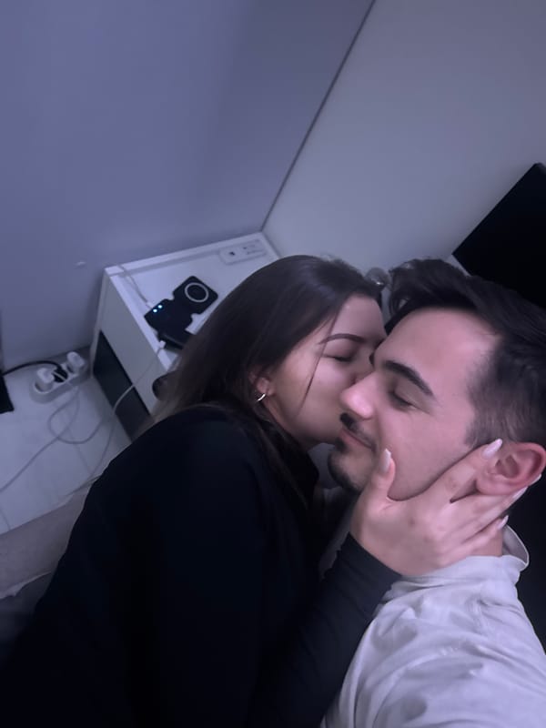 Intimate moments captured between couple in Sofia bedroom