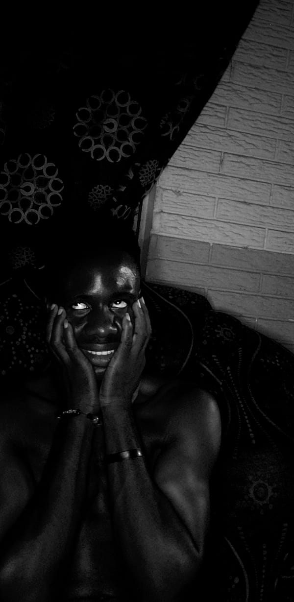 Person photographed relaxing on sofa in Narayi, Nigeria