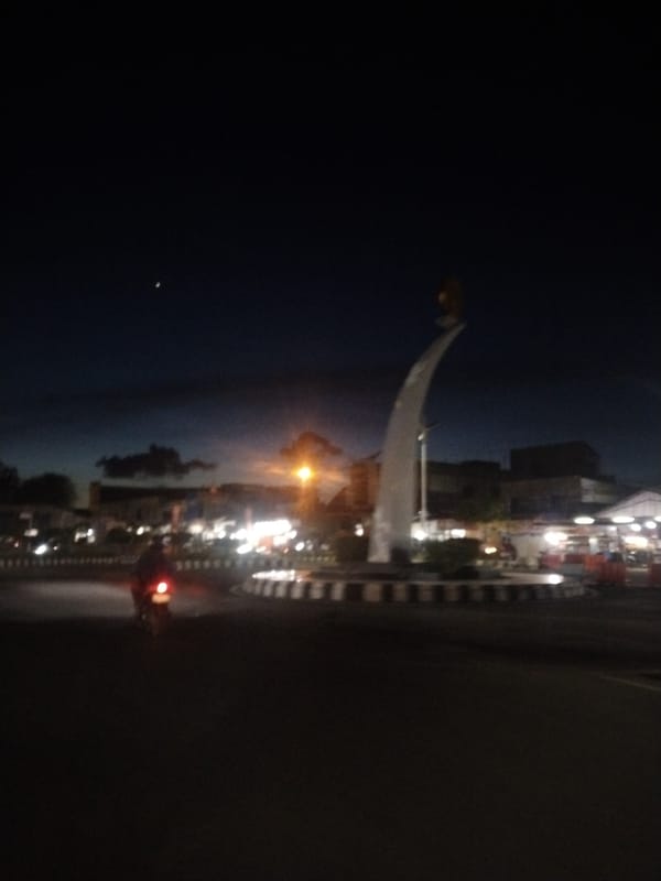 Nighttime roundabout monument captured in Lhokseumawe, Indonesia