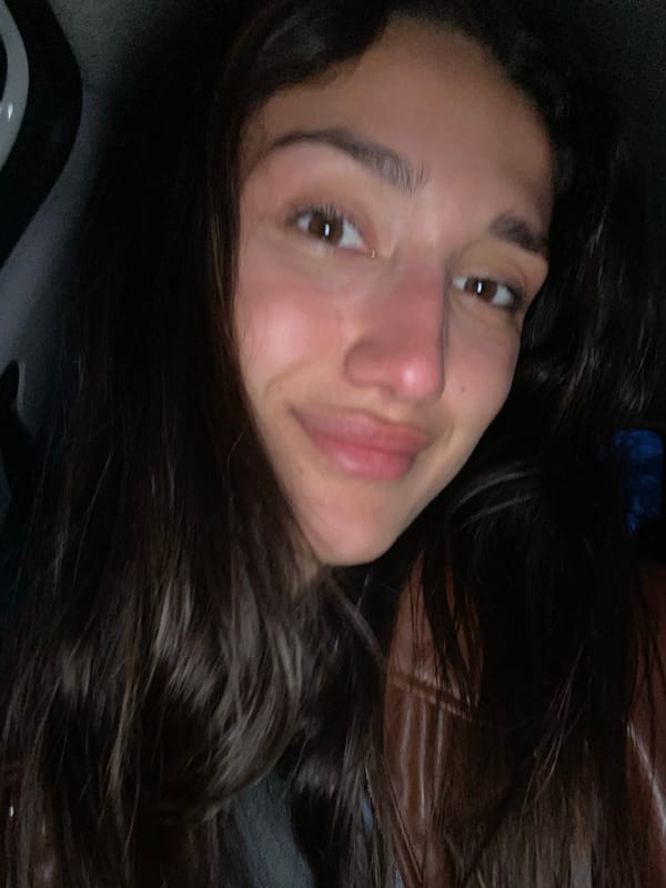 Woman photographed with snacks in car in Montenegro