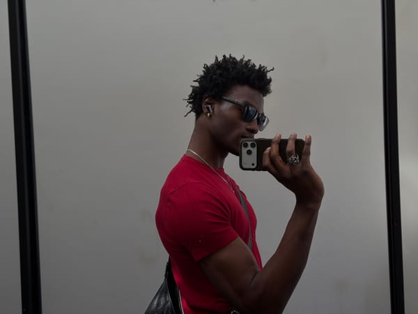 Man takes mirror selfies in London apartment hallway