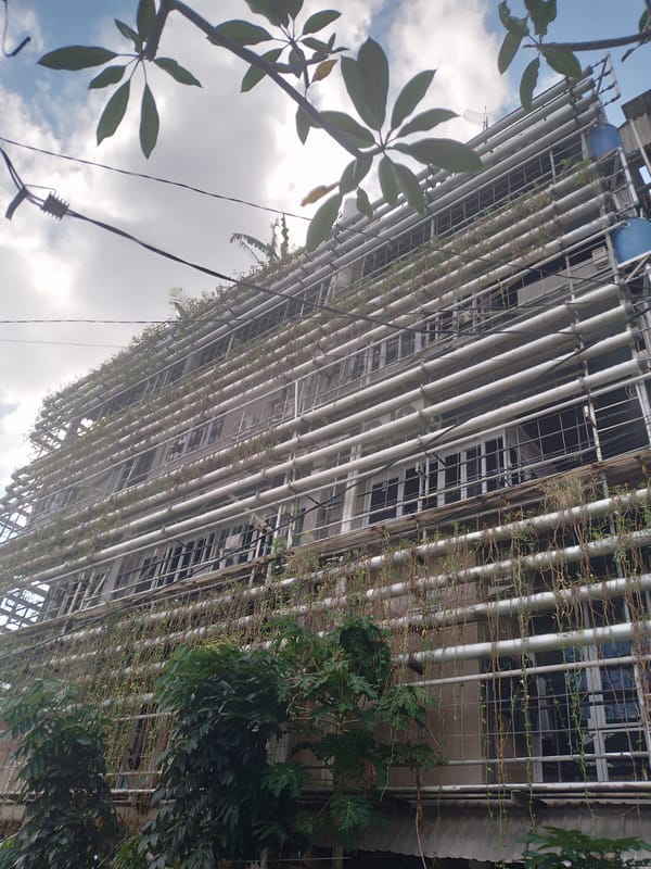 Building with silver vertical pipes documented in Kuta Selatan