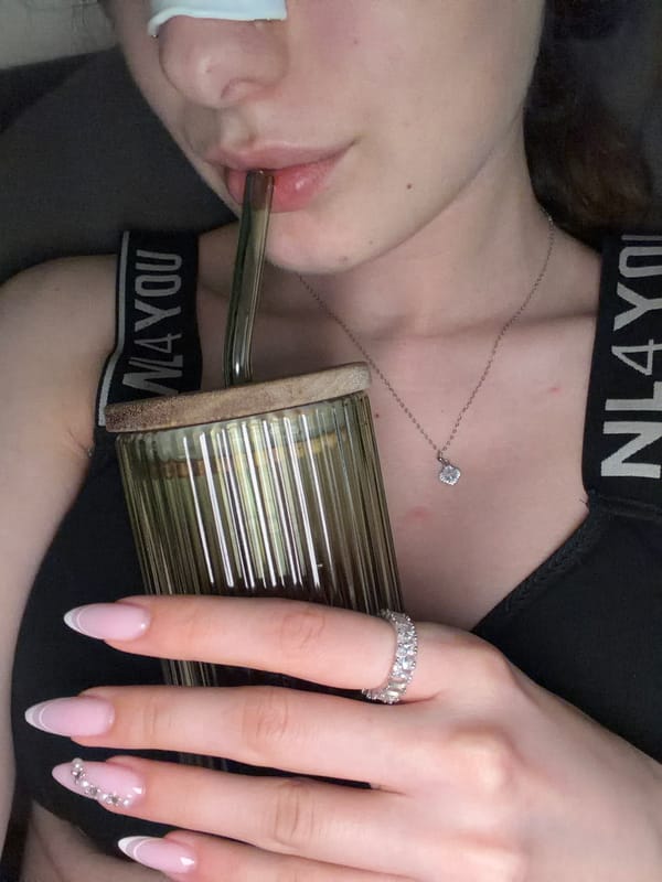 Person with drink captured in intimate moment
