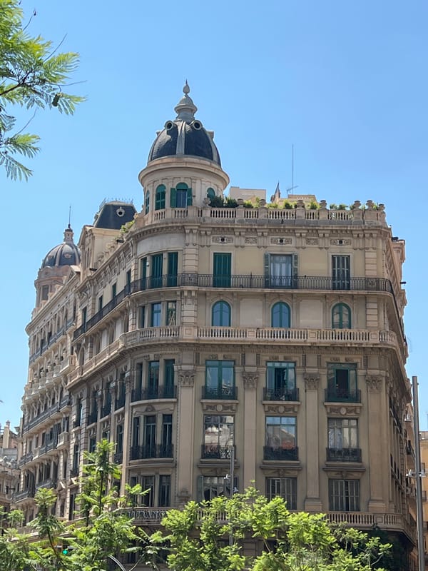 Ornate Barcelona building with balconies and classical facade details