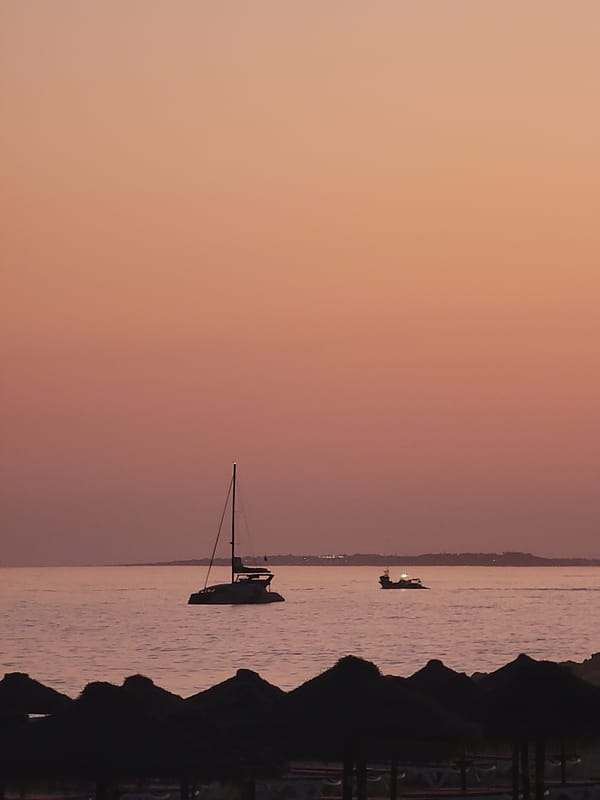 Sunset brings peaceful evening to Quarteira beach, Portugal
