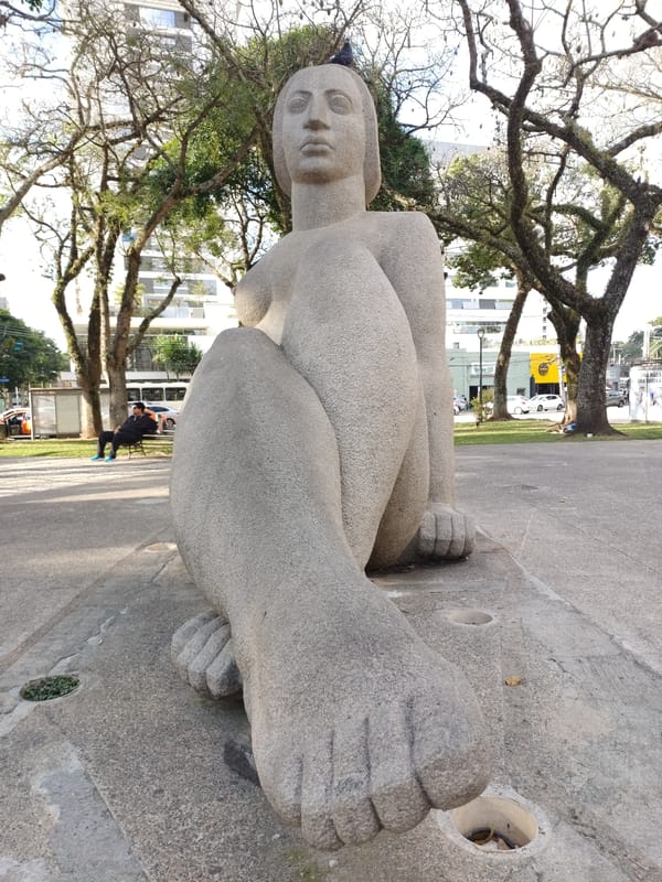 Evening street life documented around Curitiba monuments and bike stations