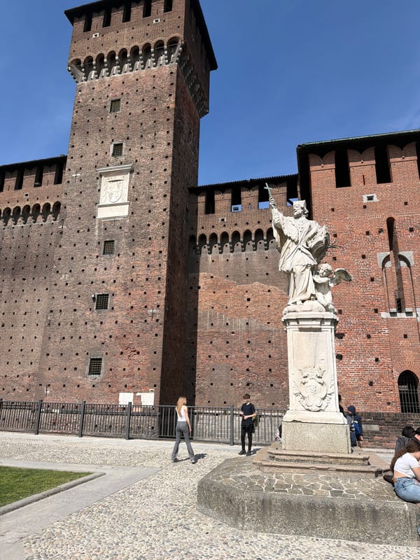 Tourist captures statuary at Milan's Sforza Castle