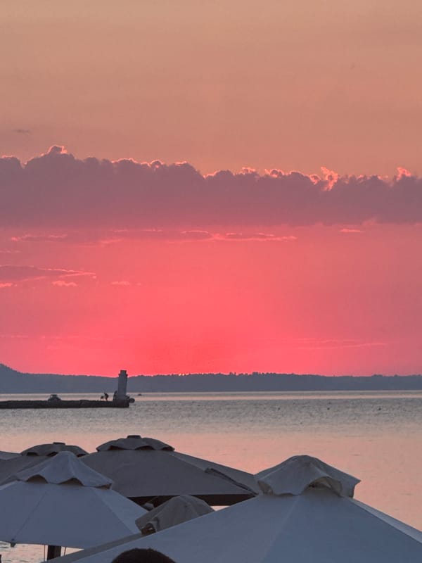 Quiet beach sunset with umbrellas, Pallini, Greece