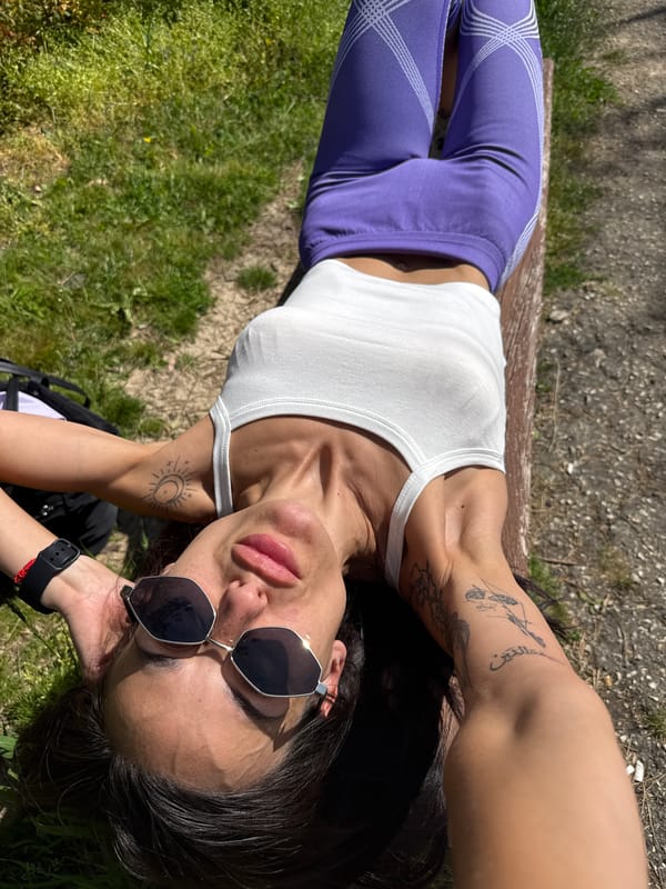 Woman rests on park bench in Pleven, Bulgaria