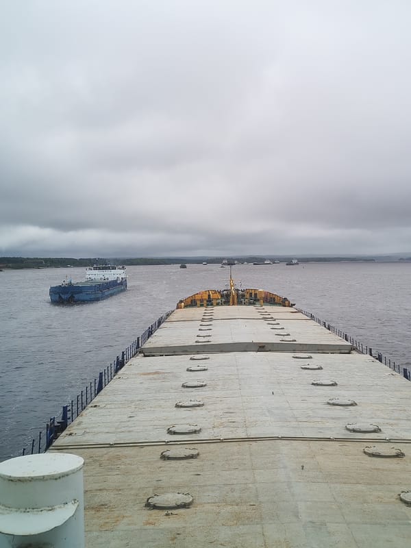 River barge traffic observed from ship deck in Vytegra