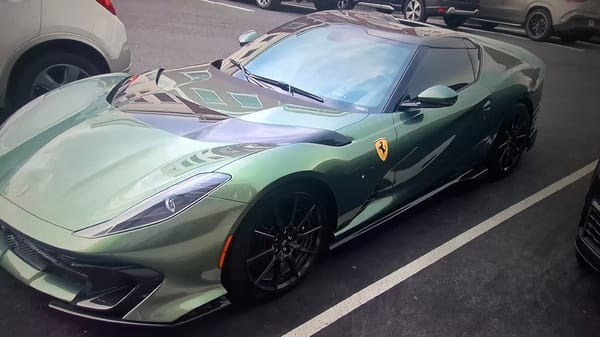 Green Ferrari 812 Competizione spotted in outdoor parking lot