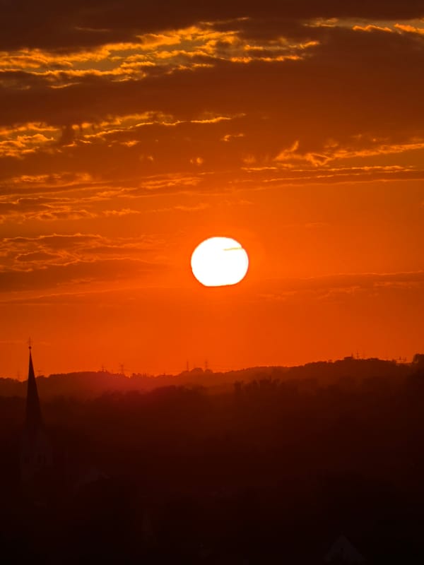 Munich sunset viewed from above, church spires in silhouette