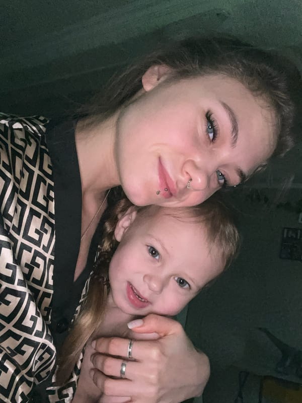 Woman takes selfies with child in Russian village