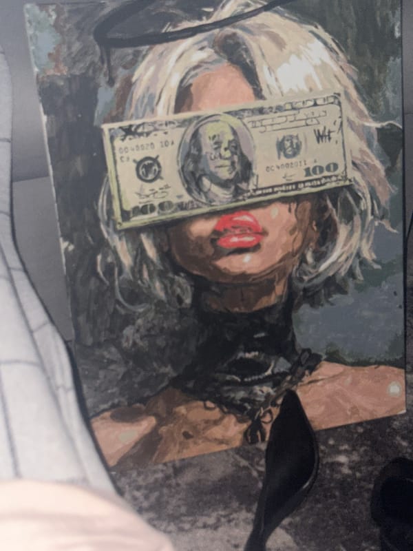 Russian witness documents portrait obscured by hundred-dollar bill, shoes