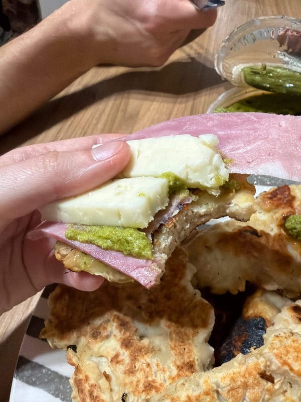 Person enjoys homemade sandwich dinner in Catania