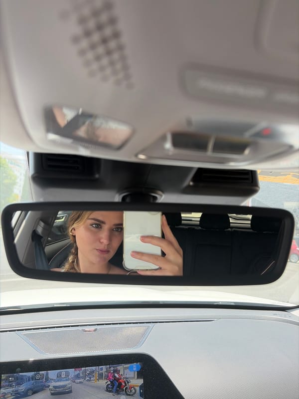Woman takes car selfies in Puebla, Mexico