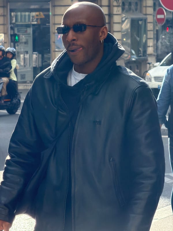 Ordinary street life continues in Paris afternoon