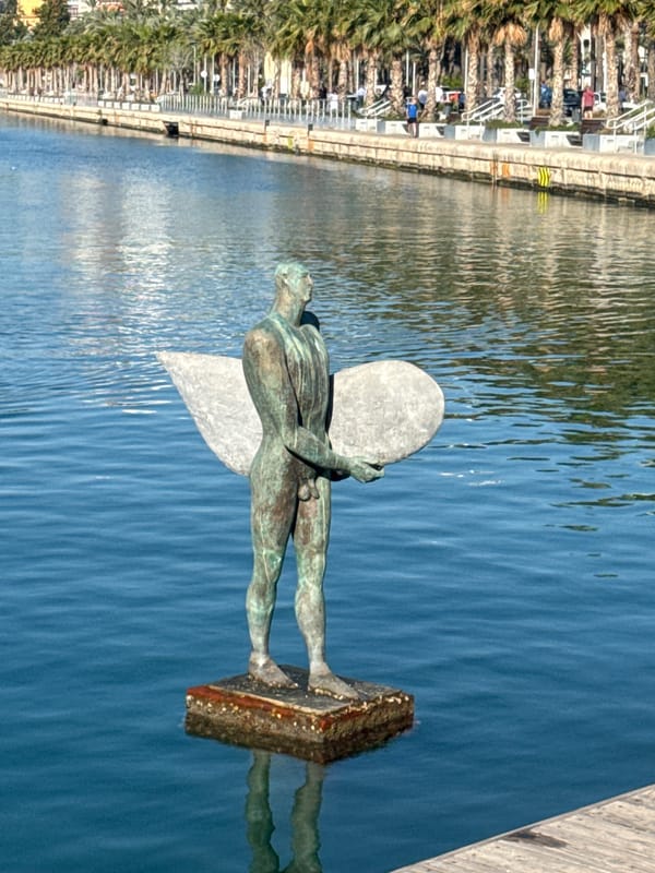 Morning harbor life: paddling, landscaping, deliveries around cruise ships