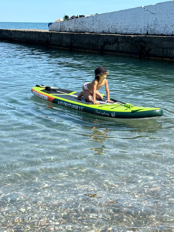 Relaxed paddleboard session on clear, calm water