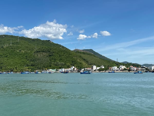 Boat trip along Vietnam's Ninh Hòa coastline on a clear day