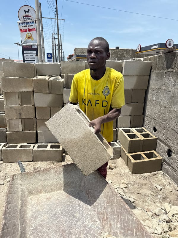 Workers clear demolition debris in Ado, Nigeria