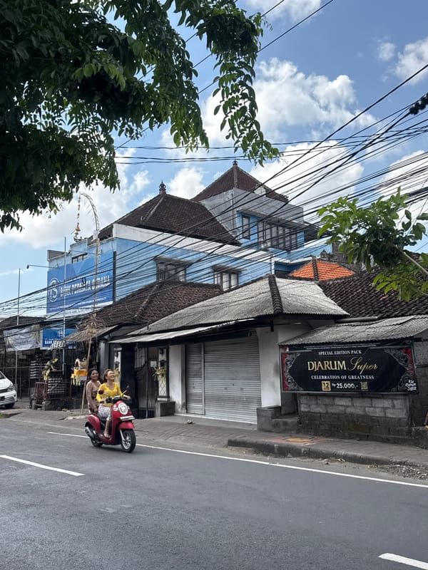 Everyday street scenes and international flags across Kuta, Bali
