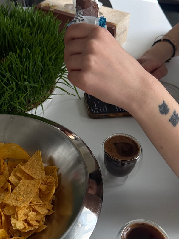 Person enjoys coffee and snacks in Yerevan cafe