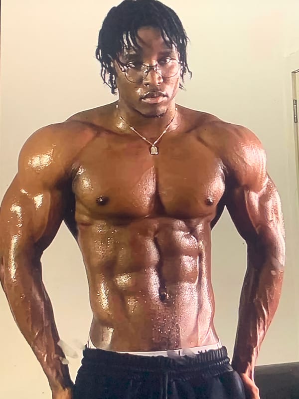Man conducts indoor workout session with weights
