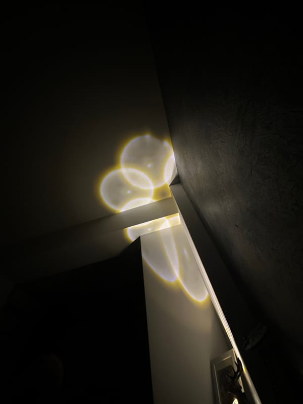 Sofia bedroom setup: gaming, ambient light, and everyday objects