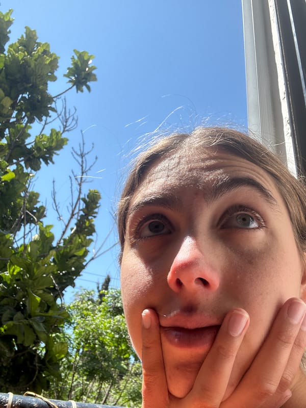 Person takes selfie with hand covering face in Givatayim