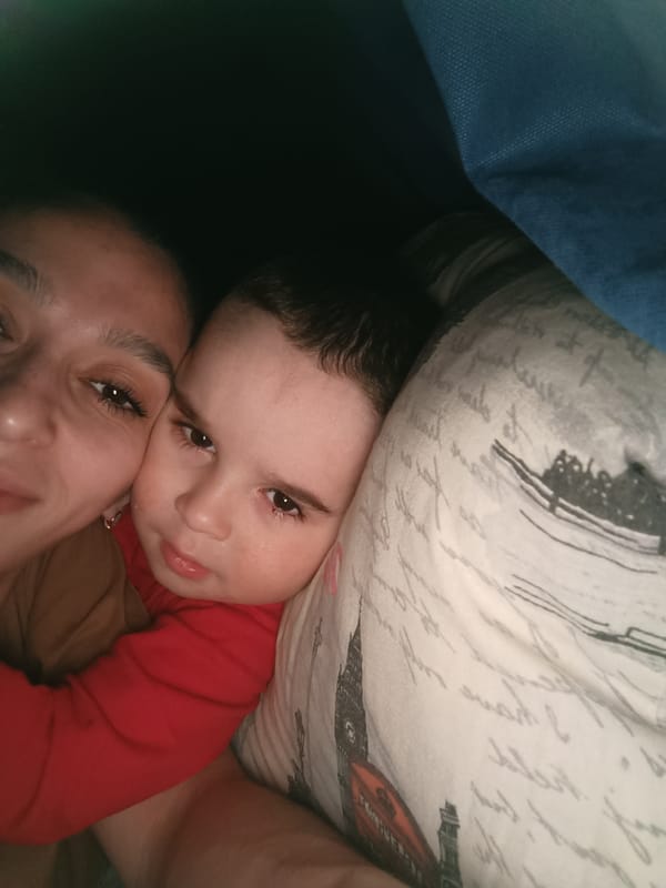 Adult and child share quiet moment in Simferopol home