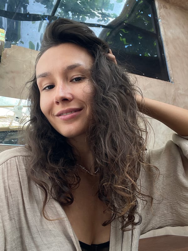 Woman enjoys morning coffee at Mũi Né cafe