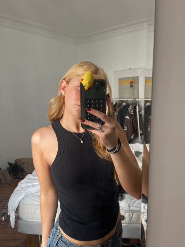 Person takes selfies with rubber duck phone in Paris