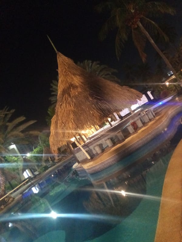 Night scenes captured at Porlamar resort pool area