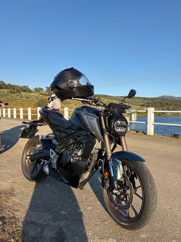 Motorcycle group ride captured from garage to sunset roadside gathering