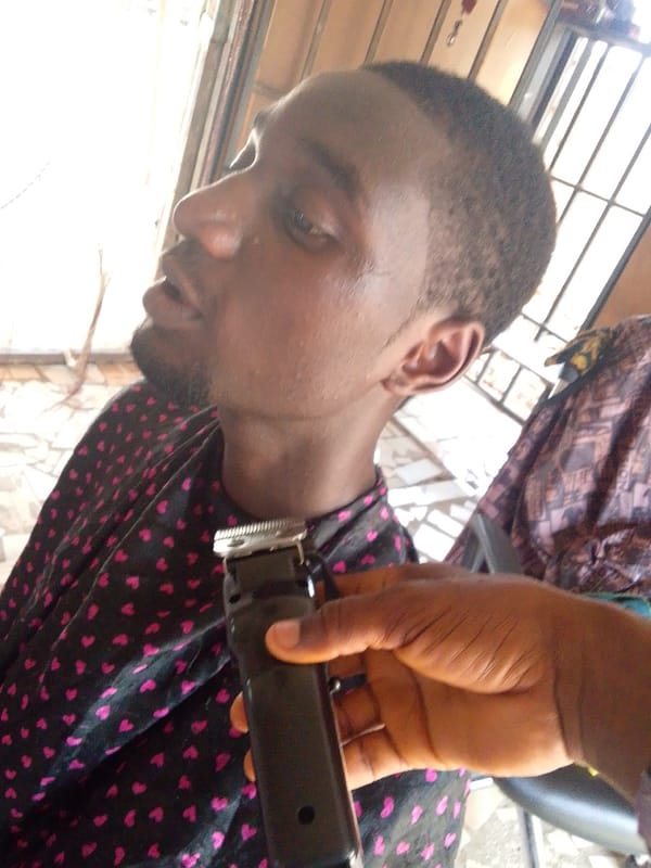 Man gets haircut, later spotted in orange hat