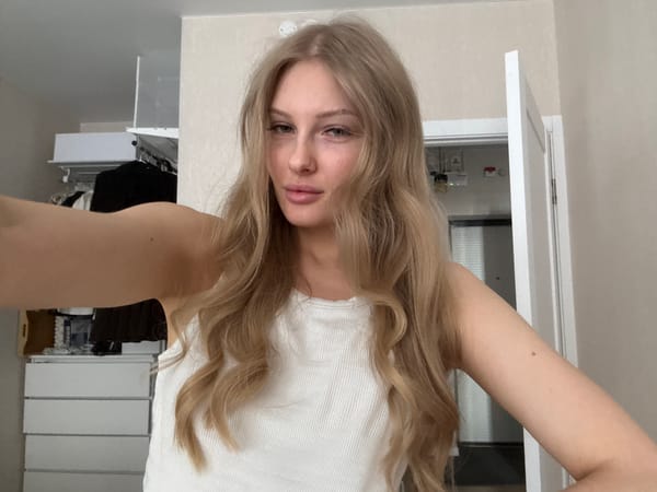 Woman takes experimental selfies in bedroom, Perm Russia