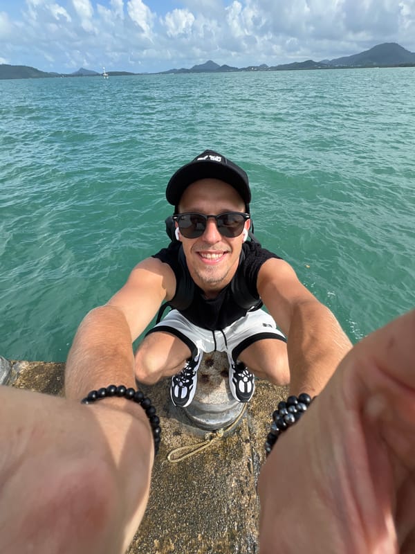 Morning at a Pa Khlok pier, boats and selfies on cloudy water