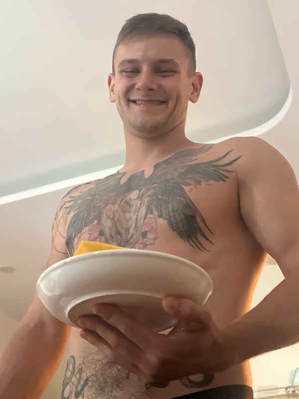 Man holds plate with yellow object in Vietnam heritage area