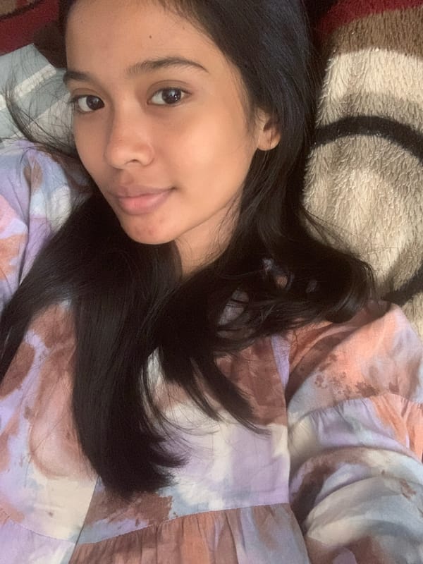 Woman captures playful morning selfie session in Indonesian town
