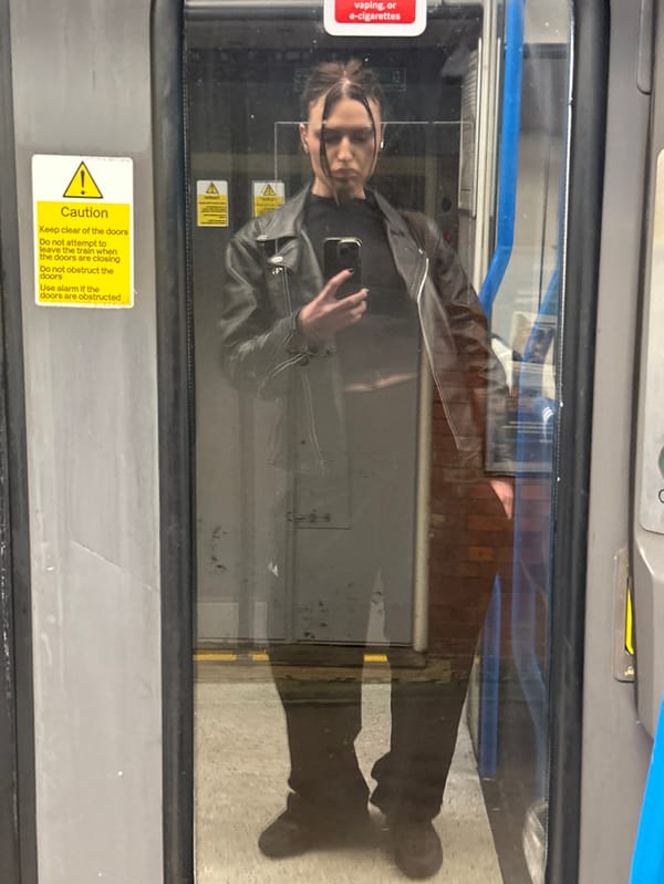 Evening commuter captures selfie amid lit windows in Tunbridge Wells