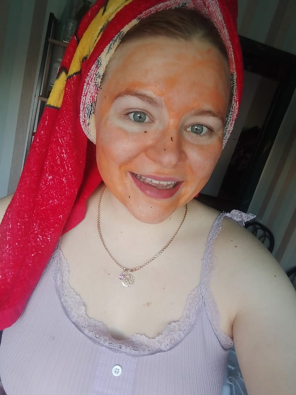 Woman takes selfies during skincare routine in Izhevsk, Russia