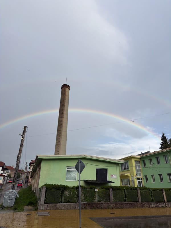 Rainbow appears over industrial smokestack in Panagyurishte, Bulgaria