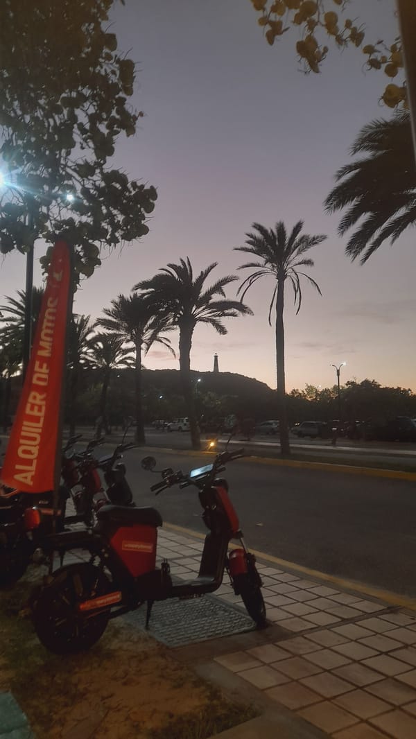 Sunset scooter rental scene in Pedro González, Venezuela