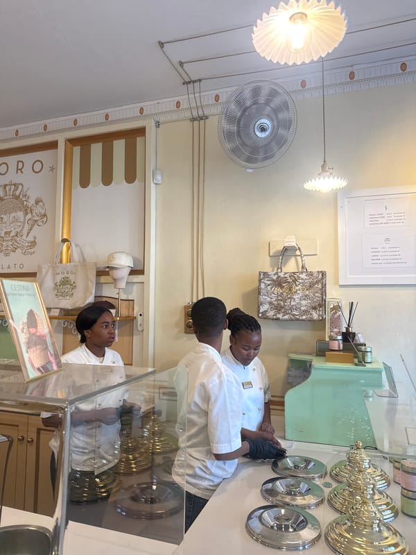 Gelato shop employee serves customers in Cape Town