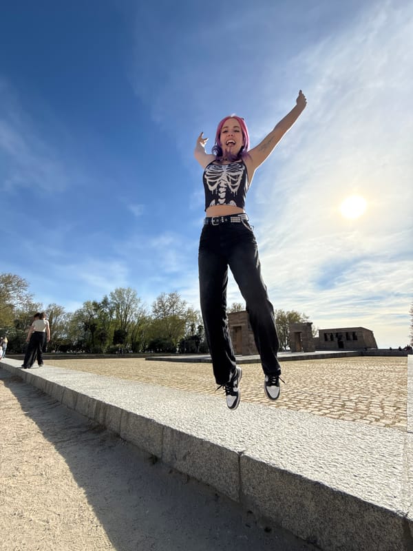 Woman poses near Temple of Debod in Madrid